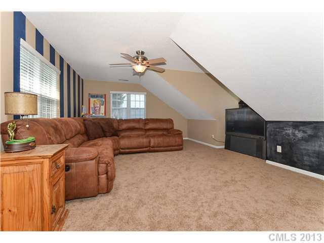 15363 Michael Andrew Road Huntersville, NC 28078 - Photo 14 of 16 a living room with furniture a ceiling fan and a window