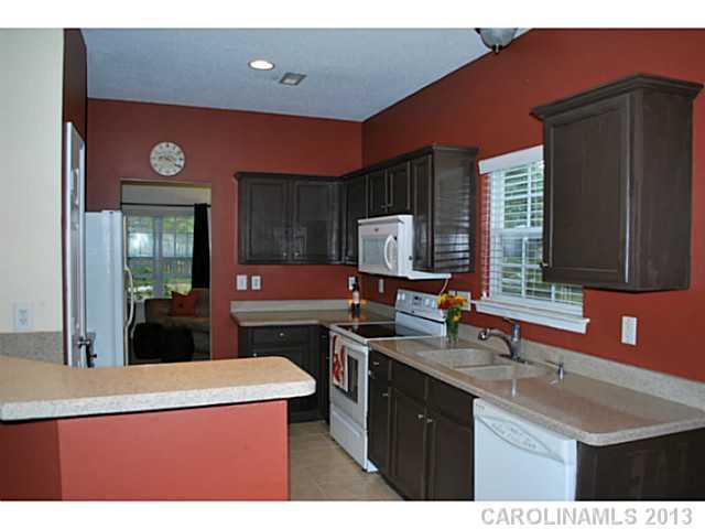 15363 Michael Andrew Road Huntersville, NC 28078 - Photo 5 of 16 a kitchen with stainless steel appliances granite countertop a sink a stove and a refrigerator