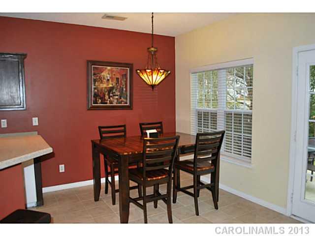 15363 Michael Andrew Road Huntersville, NC 28078 - Photo 6 of 16 a view of a dining room with furniture and chandelier