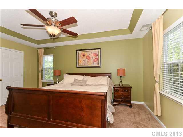 15363 Michael Andrew Road Huntersville, NC 28078 - Photo 8 of 16 a bed room with a bed mirror and a window