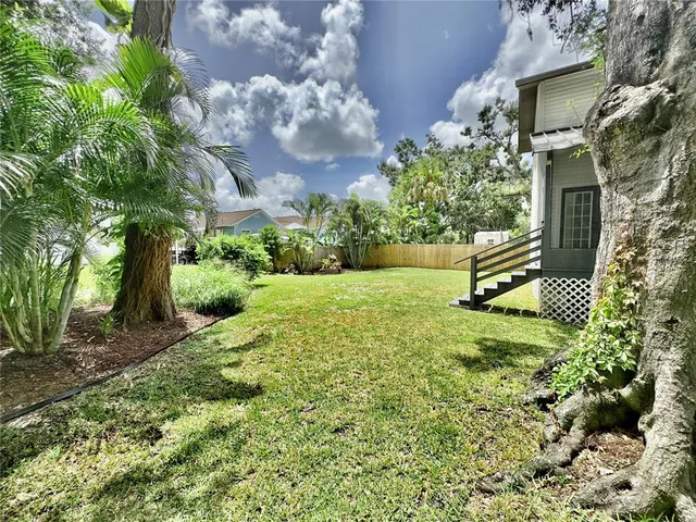 a view of a porch with wooden floor and outdoor space