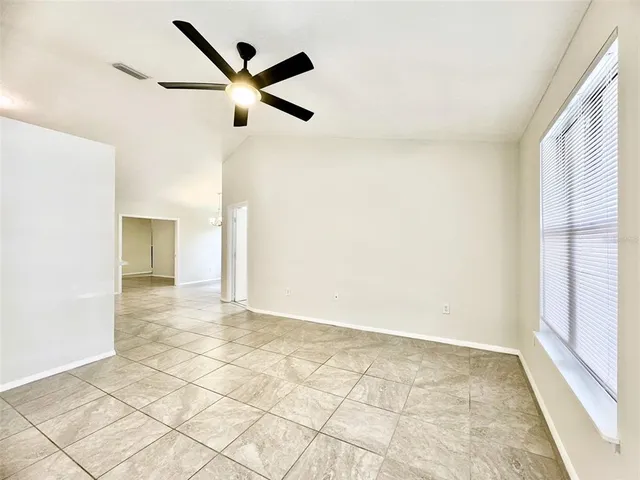 a large kitchen with stainless steel appliances granite countertop a stove and a sink