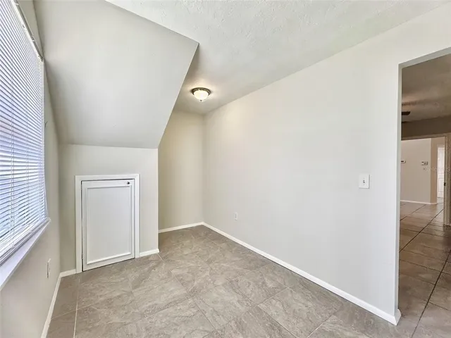 a bathroom with a granite countertop sink a mirror and a shower