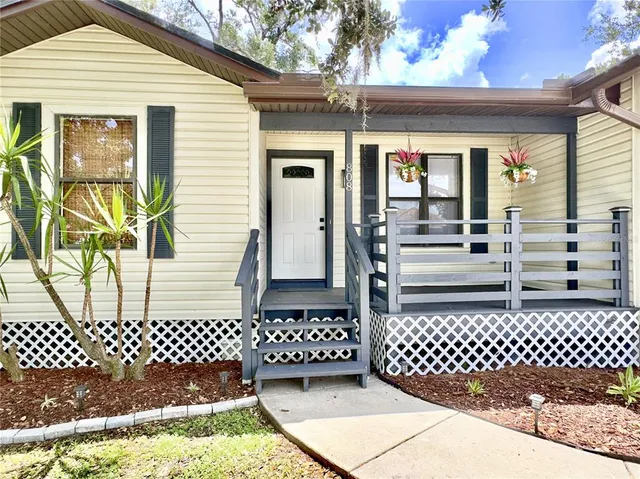 a view of a porch with wooden floor