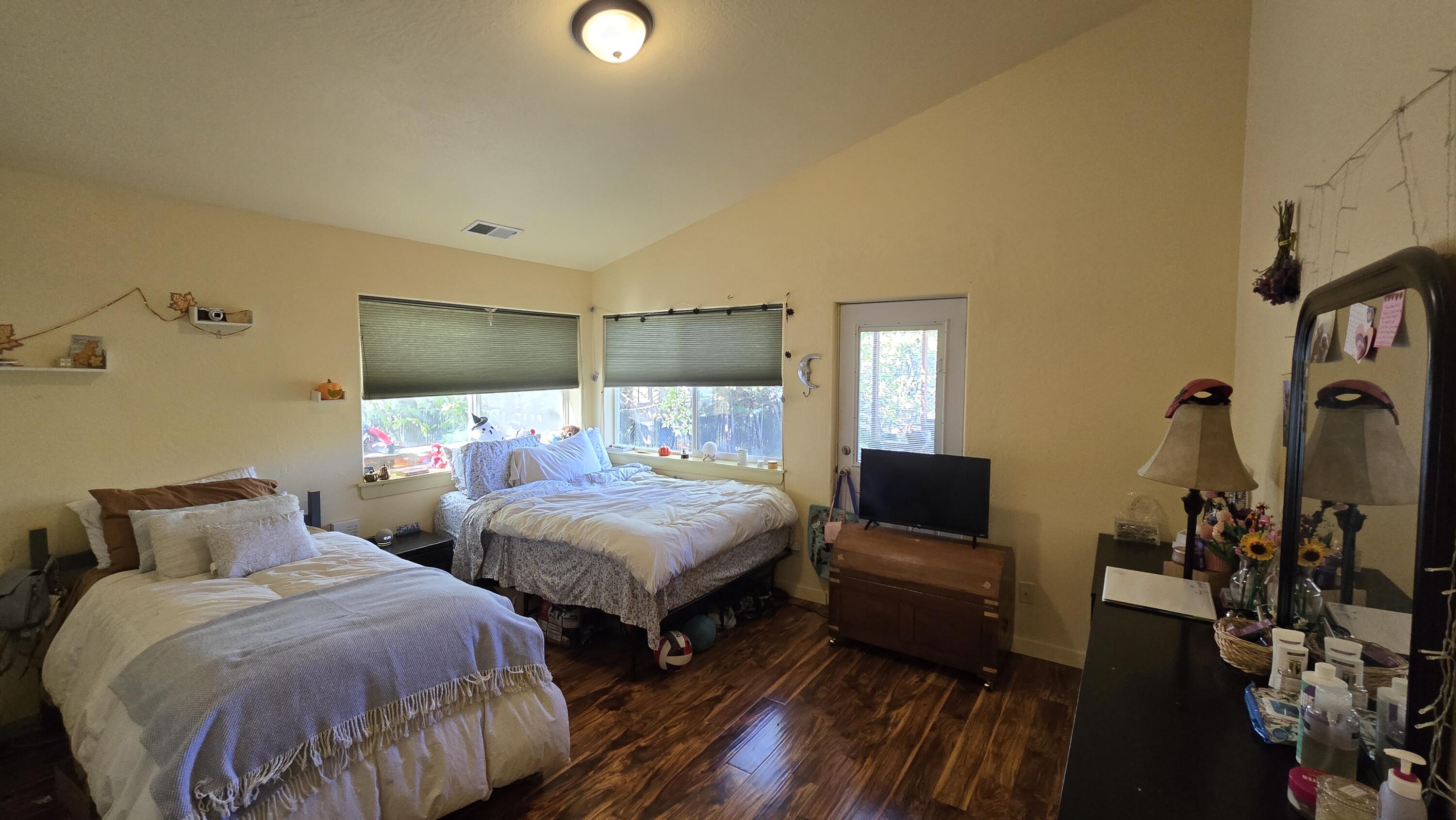 488 Crowson Road Ashland, OR 97520 - Photo 13 of 30 a bedroom with two beds and a flat screen tv