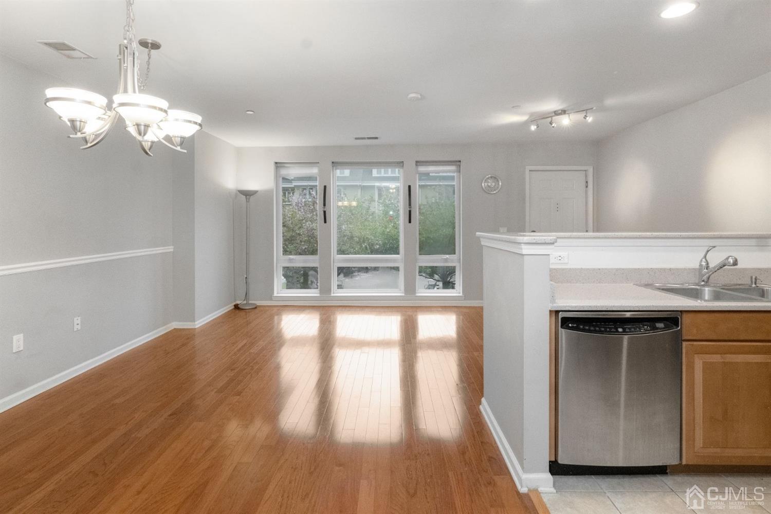 368 Rector Street, Unit 422 Perth Amboy, NJ 08861 - Photo 7 of 17 a view of a kitchen with a sink dishwasher and wooden floor