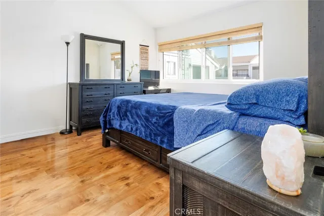 a bedroom with a bed and window