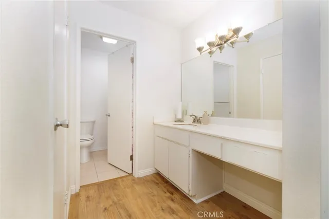 a bathroom with a double vanity sink mirror and