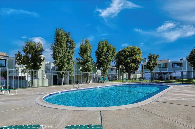 a view of a swimming pool with a yard