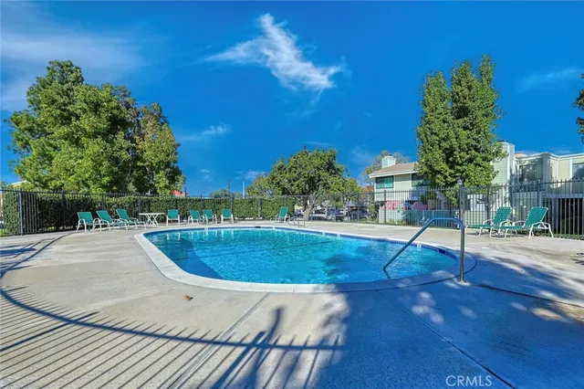 a view of a swimming pool with a patio