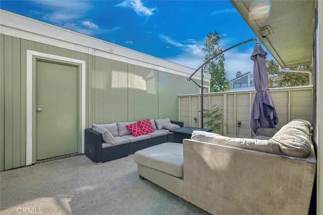 a outdoor living space with furniture and a ceiling fan