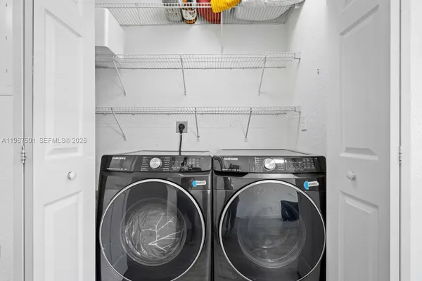 a utility room with dryer and washer