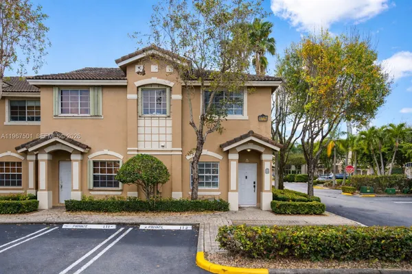 front view of a house with a garden