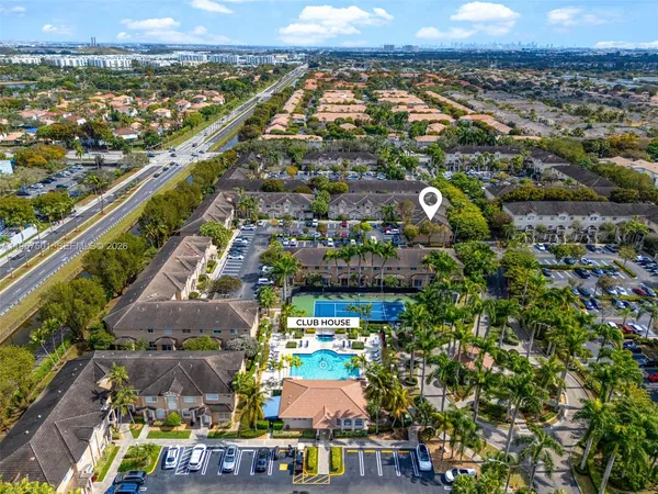 an aerial view of residential building and lake