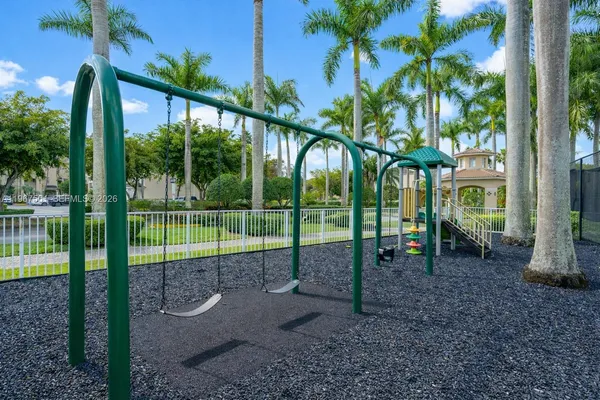 a view of a park with a large tree