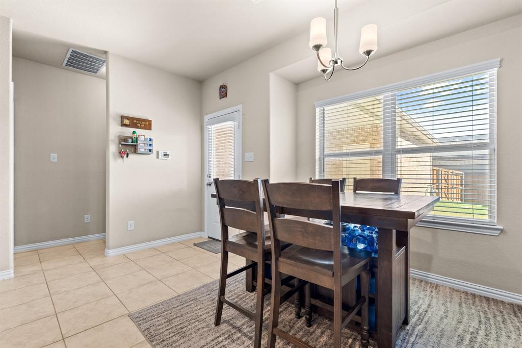 4207 Whispering Willow Way Arlington, TX 76005 - Photo 16 of 31 a view of a dining room with furniture and window
