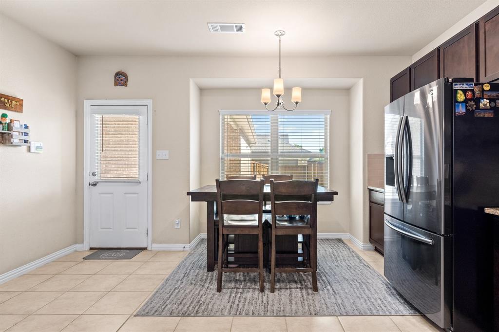 4207 Whispering Willow Way Arlington, TX 76005 - Photo 17 of 31 a dining room well furnished