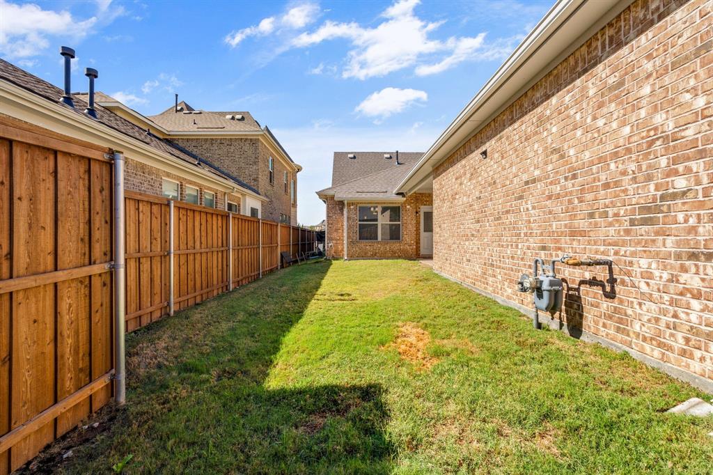 4207 Whispering Willow Way Arlington, TX 76005 - Photo 25 of 31 a view of backyard with a garden