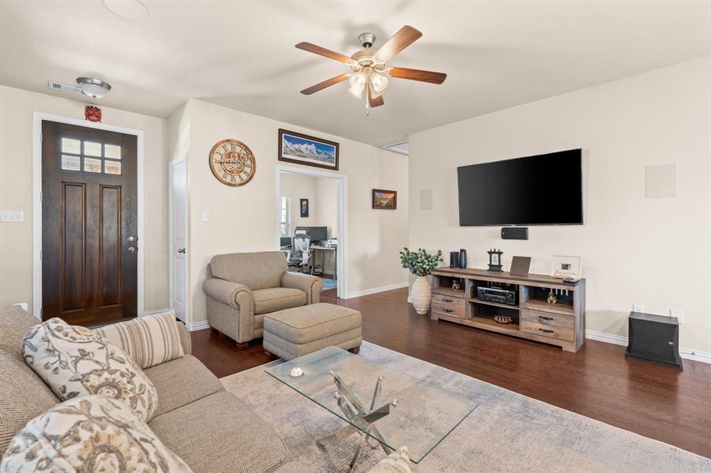 4207 Whispering Willow Way Arlington, TX 76005 - Photo 4 of 31 a living room with furniture and a flat screen tv