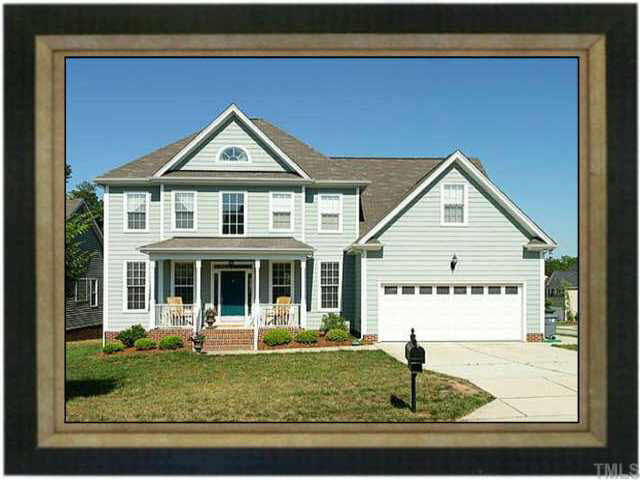 5900 Currin Fox Court Raleigh, NC 27616 - Photo 1 of 10 a view of a white house next to a yard with wooden fence