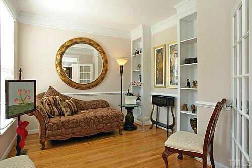 5900 Currin Fox Court Raleigh, NC 27616 - Photo 5 of 10 a living room with furniture a mirror and a wooden floor