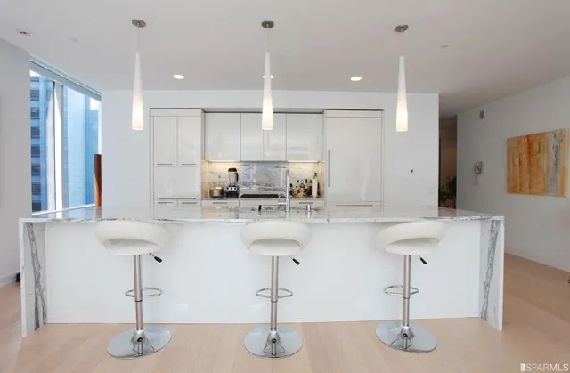 a kitchen with counter top space cabinets and appliances