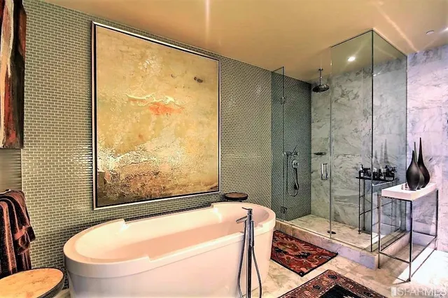 a bathroom with a tub and sink