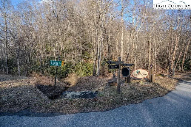 a view of a backyard with sitting area