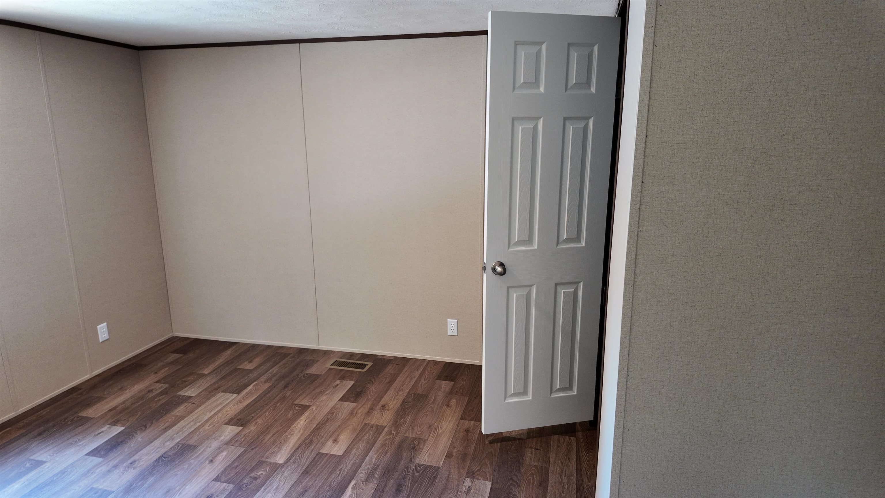 208 Marcy Cove Ripley, TN 38063 - Photo 6 of 14 Unfurnished room with wood finished floors