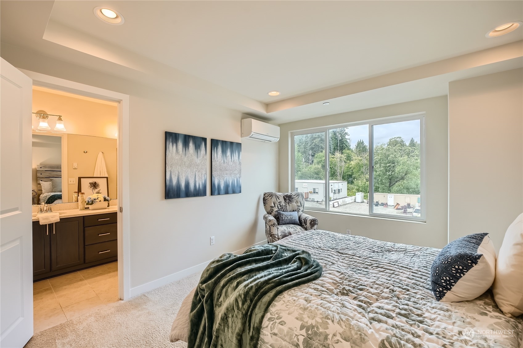 603 237th Street Southeast, Unit B Bothell, WA 98021 - Photo 14 of 27 a bedroom with a bed and a large window