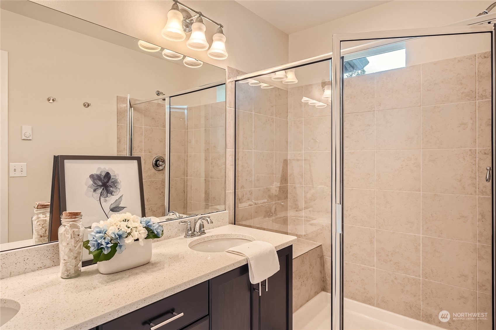 603 237th Street Southeast, Unit B Bothell, WA 98021 - Photo 15 of 27 a bathroom with a double vanity sink and a mirror