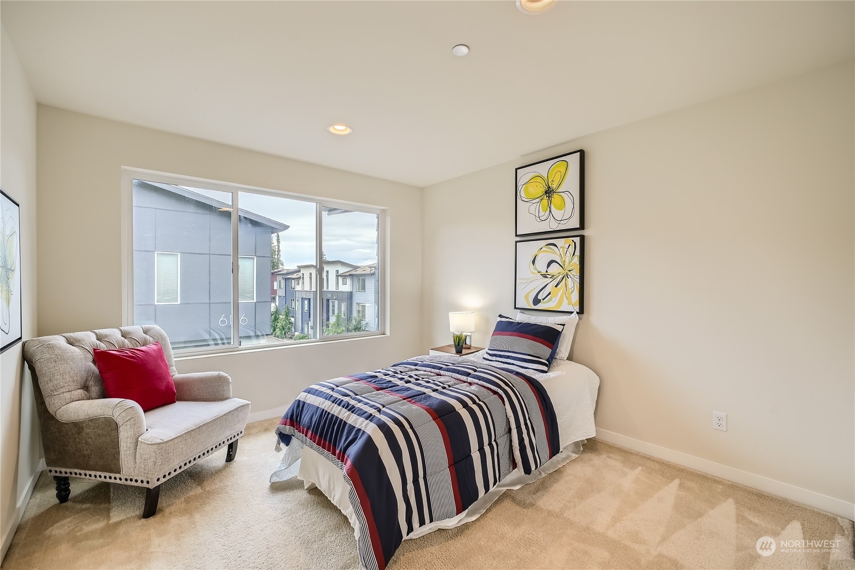 603 237th Street Southeast, Unit B Bothell, WA 98021 - Photo 17 of 27 a bedroom with a bed and wooden floor