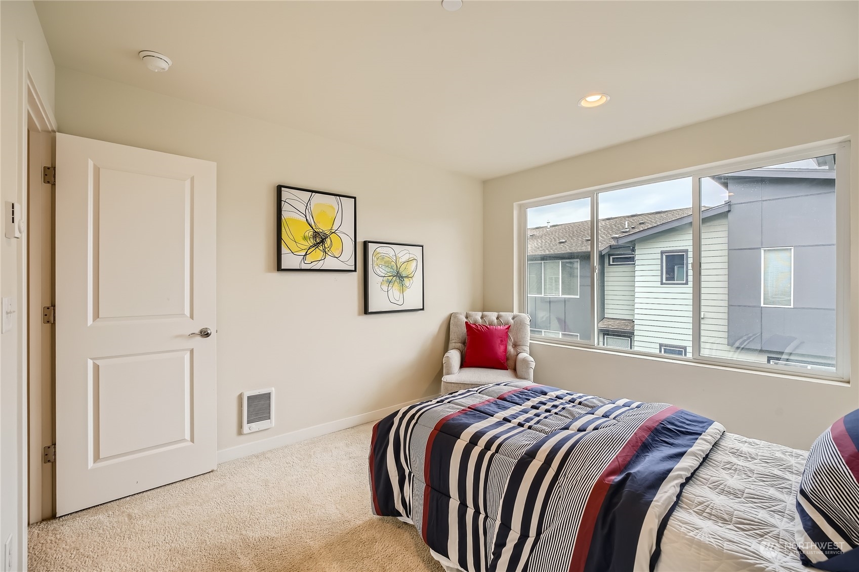 603 237th Street Southeast, Unit B Bothell, WA 98021 - Photo 18 of 27 a bedroom with a bed and a large window