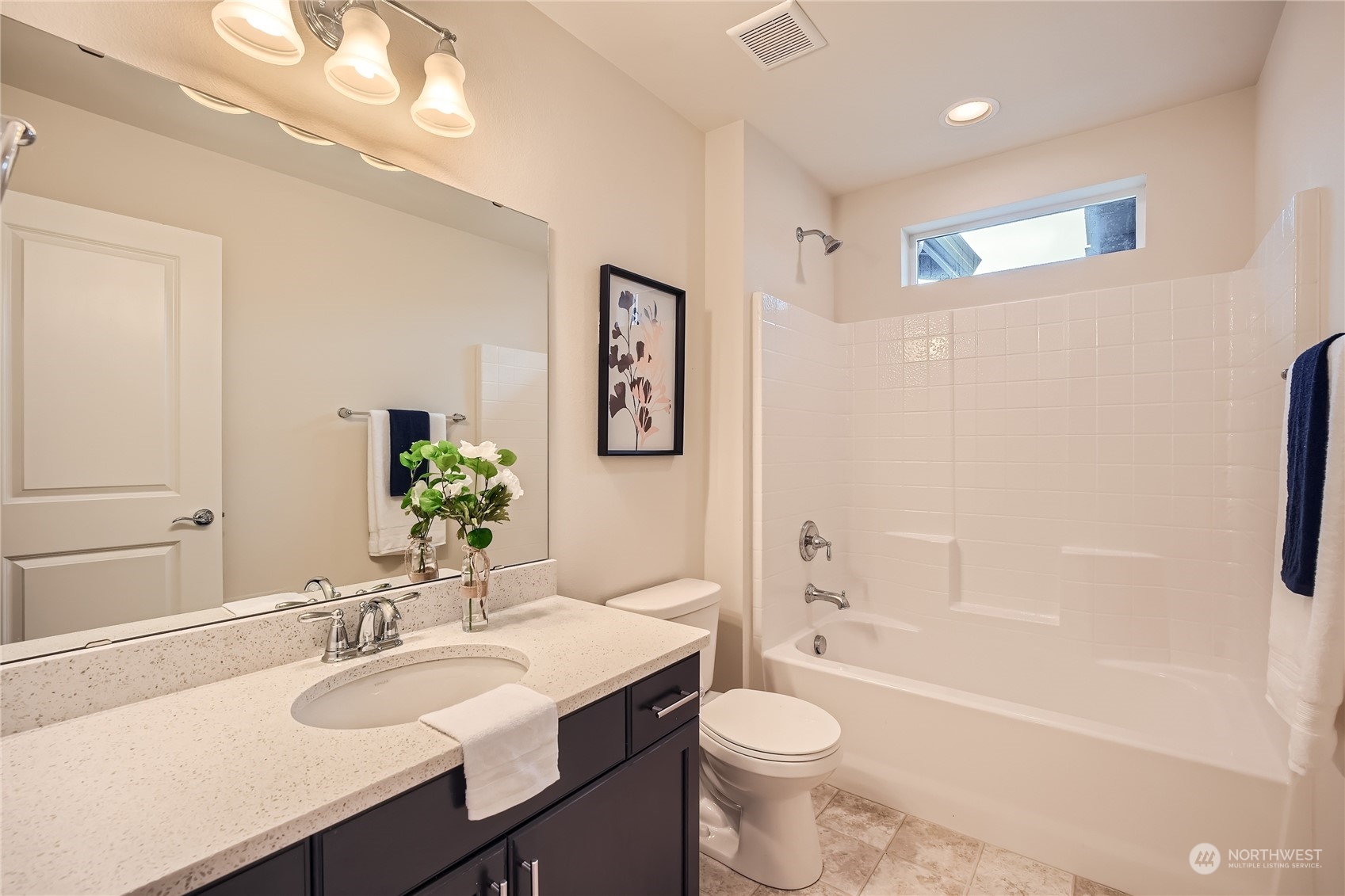 603 237th Street Southeast, Unit B Bothell, WA 98021 - Photo 19 of 27 a bathroom with a granite countertop sink a toilet a bathtub and shower