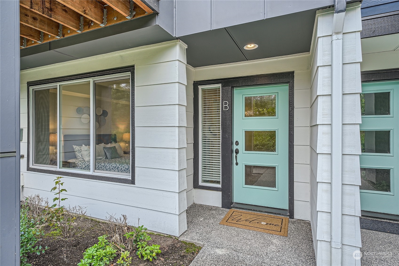 603 237th Street Southeast, Unit B Bothell, WA 98021 - Photo 2 of 27 a front view of a house with a yard