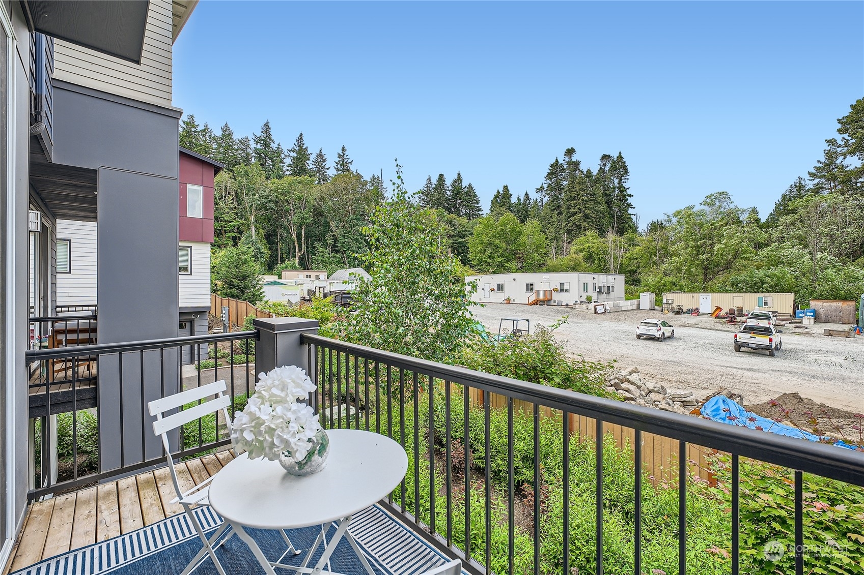 603 237th Street Southeast, Unit B Bothell, WA 98021 - Photo 26 of 27 a view of a balcony with wooden floor and outdoor seating