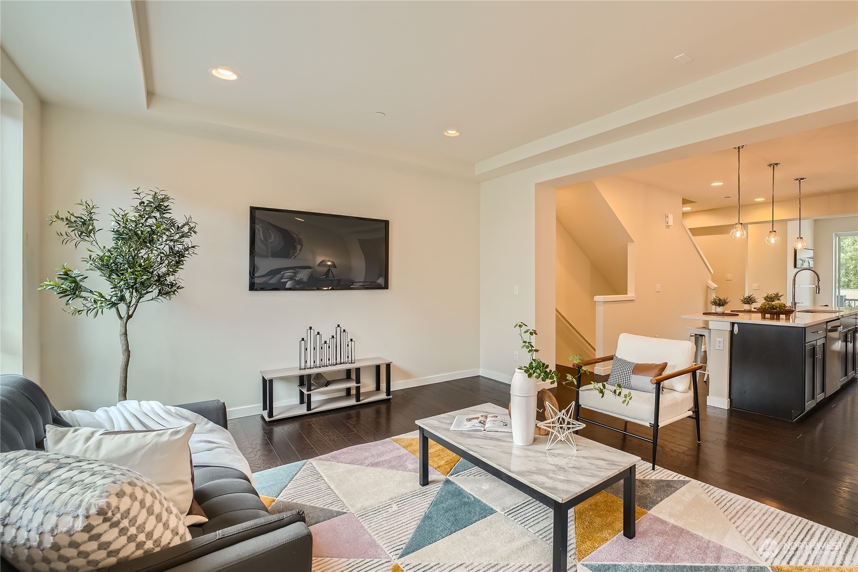 603 237th Street Southeast, Unit B Bothell, WA 98021 - Photo 5 of 27 a living room with furniture and a flat screen tv