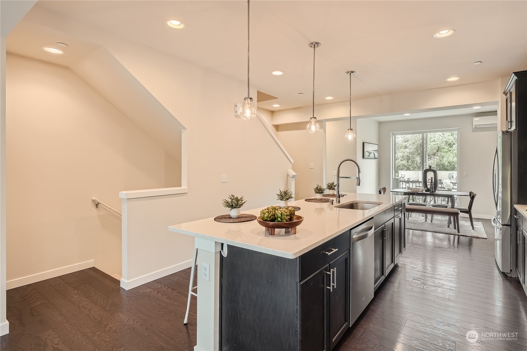 603 237th Street Southeast, Unit B Bothell, WA 98021 - Photo 9 of 27 a kitchen with a sink stove and wooden floor
