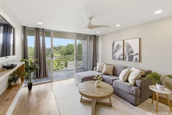 a living room with furniture and a large window