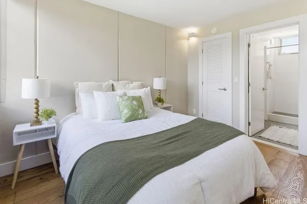a bedroom with a bed and a table