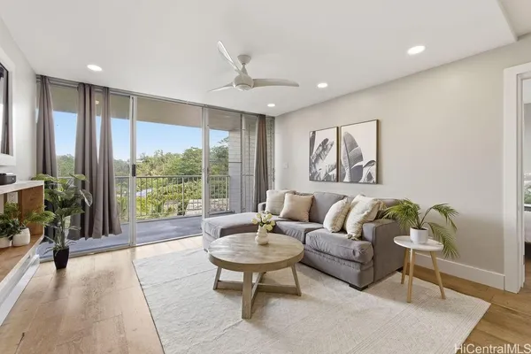 a living room with furniture and a large window
