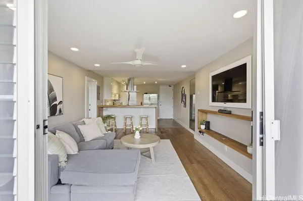 a living room with furniture and a flat screen tv