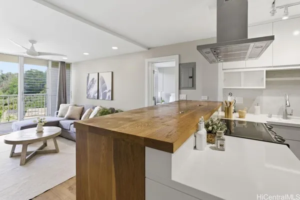 a kitchen with a stove a sink and a refrigerator