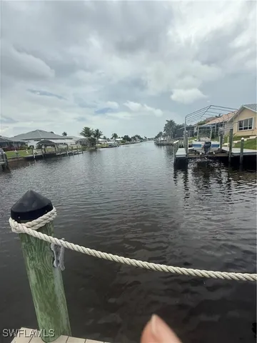 a bathroom with a granite countertop sink toilet mirror and bathtub