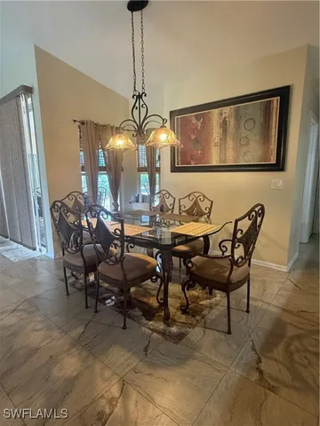 a view of a dining room with furniture