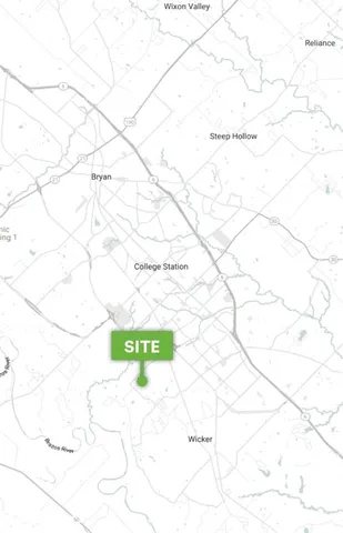 a white toilet sitting next to a white wall