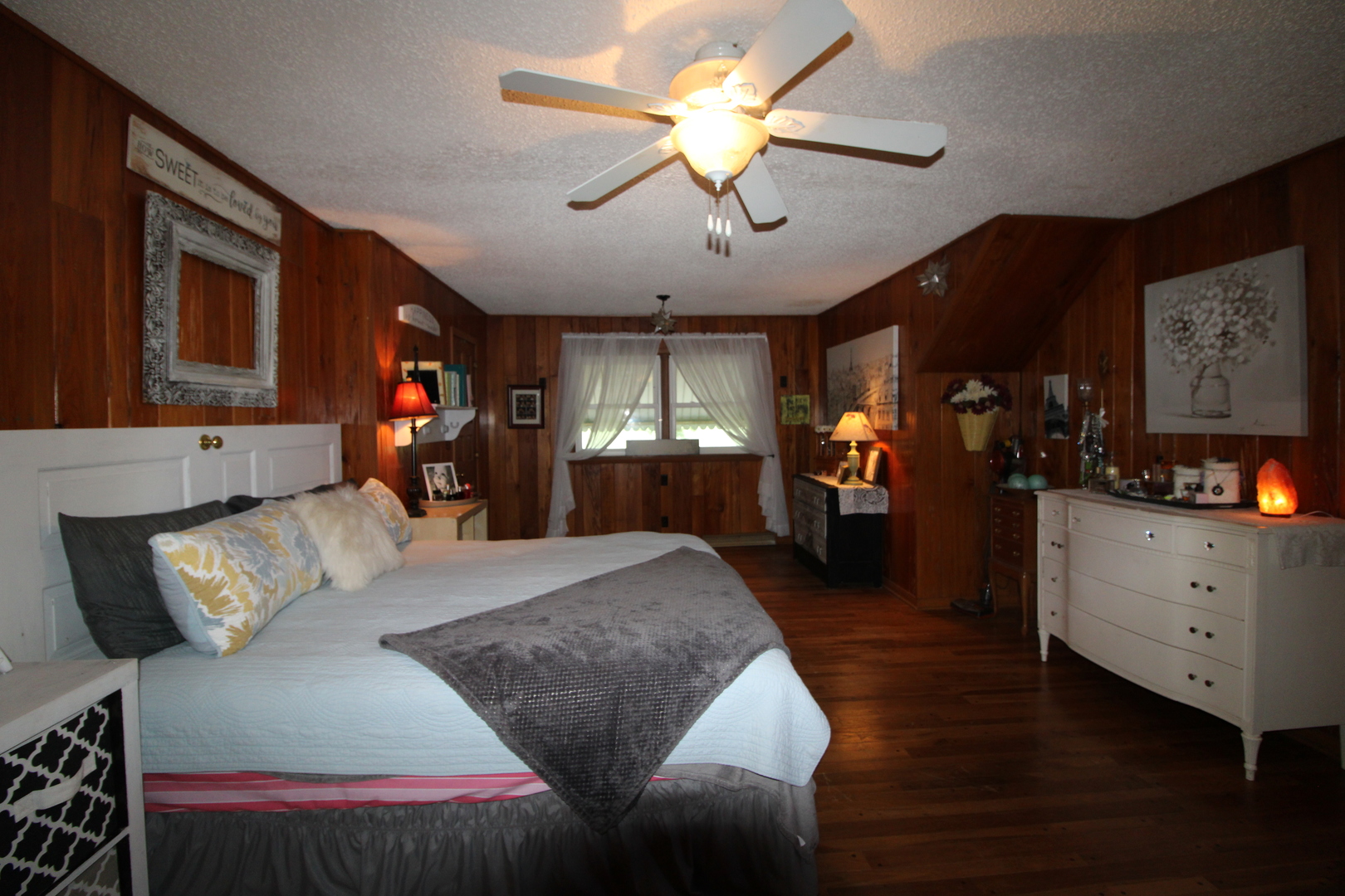 9033 Crego Road Waterman, IL 60556 - Photo 12 of 21 a bed room with furniture and a flat screen tv