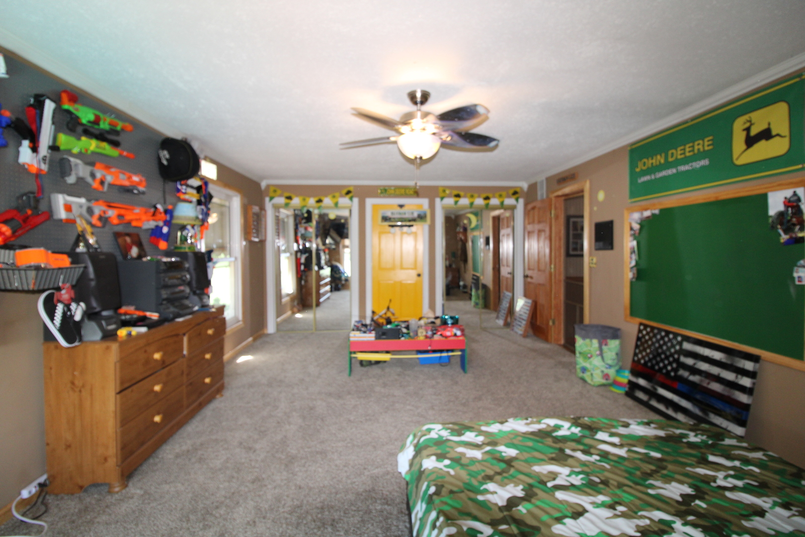 9033 Crego Road Waterman, IL 60556 - Photo 15 of 21 a bedroom with furniture and a flat screen tv