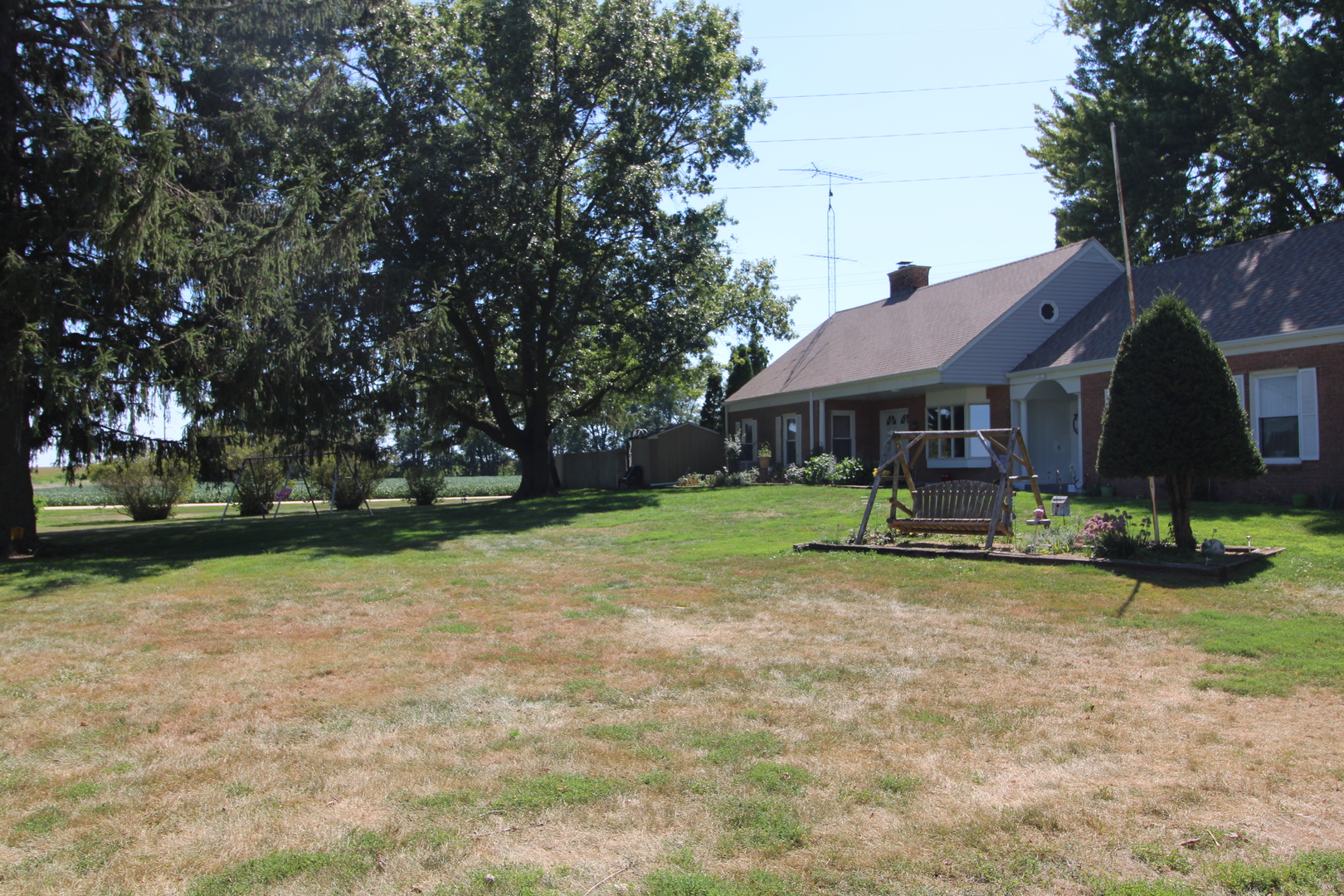 9033 Crego Road Waterman, IL 60556 - Photo 20 of 21 a view of house with outdoor space and swimming pool