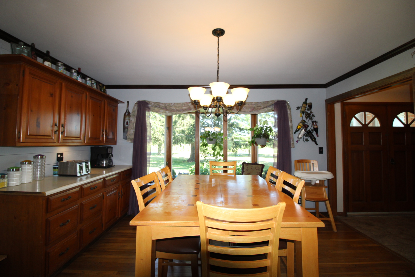 9033 Crego Road Waterman, IL 60556 - Photo 4 of 21 a dining room with furniture a chandelier and window